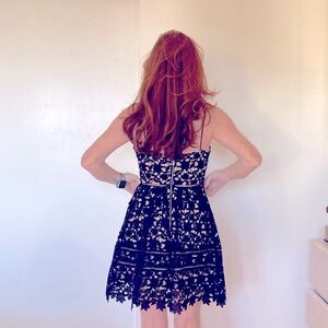 Mid thigh black dress. Lined. Fun and elegant!